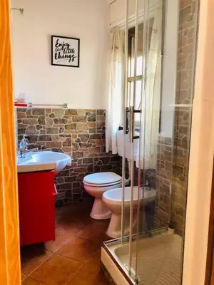 a bathroom with a toilet and a sink at Teatro Massimo Apartment- SELF CHECK-IN in Palermo