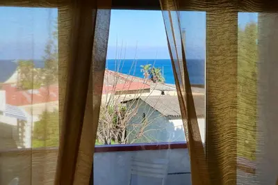 a view of the ocean from a window at Spacious apartment with sea view in Alcamo, 180 m² in Alcamo