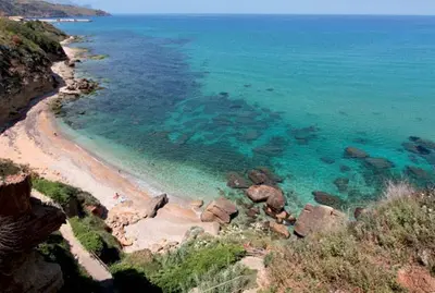 an aerial view of a beach with rocks and water at CASE VACANZE NONNA NICK in Castellammare del Golfo
