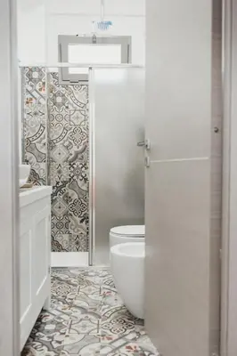 a bathroom with a toilet and a sink at Giardini del Golfo Villa al Mare in Balestrate