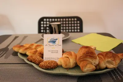 a plate of croissants and other pastries on a table at LA FINESTRA SUL PORTO in Palermo