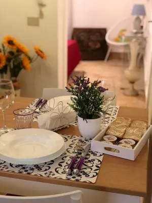 a table with a plate of food on a table at La casa del Cedro in Palermo