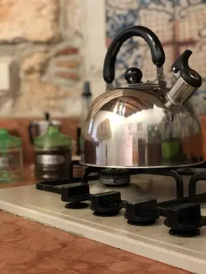 a tea kettle sitting on top of a stove at La casa del Cedro in Palermo
