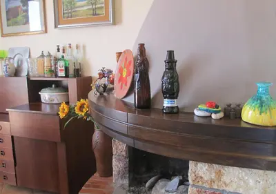 a room with a table with bottles on it at Casa Vacanza nell'Orto in Termini Imerese