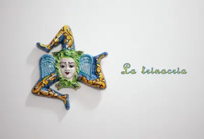a pin with a clown face on a wall at La Trinacria in Terrasini