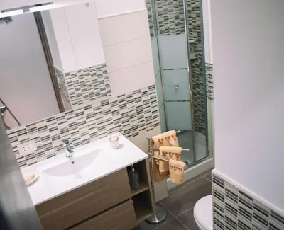 a bathroom with a sink and a shower at La Trinacria in Terrasini