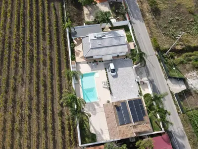 an overhead view of a house with solar panels on it at villa Roby in Trappeto