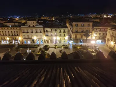 a view from the roof of a building at night at Affitto breve Casa Taormina in Palermo