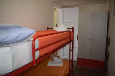 a couple of bunk beds in a room at Affitto breve Casa Taormina in Palermo