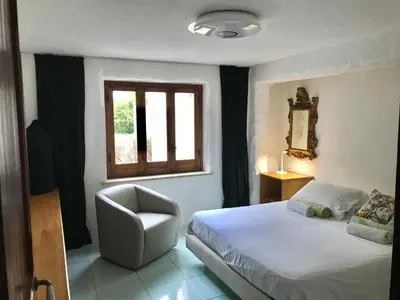 a dining room with a table and an open door at Park House in Mondello