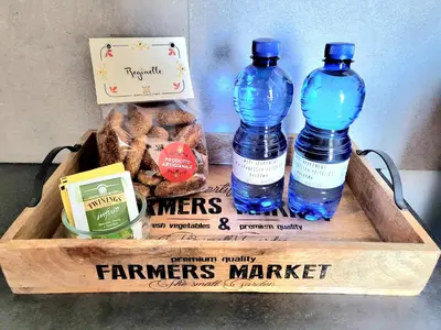 two bottles of water and a box of bread at I Mori Apartment in Palermo