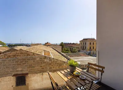 a room with two mirrors and a tv at I Mori Apartment in Palermo