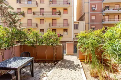a bench sitting in front of a building at Nino's house in Palermo