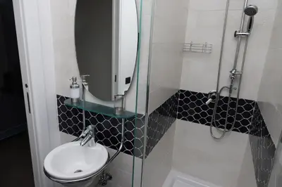 a bathroom with a sink and a mirror at b&b Pirriera in Bagheria