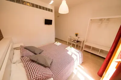 a room with a bed with two pillows on it at La Balestra B&B in Balestrate