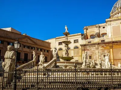 a fountain in front of a building at Sant'Agostino Apartment with Terrace by Wonderful Italy in Palermo