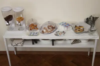 a white table with food on top of it at B&B Alexander-Room and Breakfast in Palermo