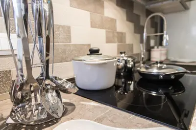 a kitchen counter with a mixer on a counter top at Maison Heloise in Palermo