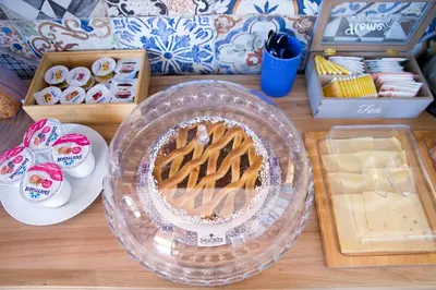 a table with a cake and other items on it at Residenza Normanna in Palermo