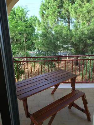 a wooden bench sitting on top of a balcony at Villa Augustea in Alcamo