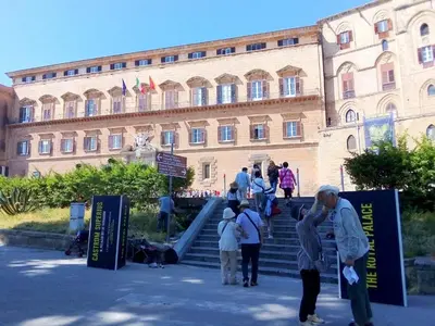 a group of people standing in front of a building at Normanni Homes in Palermo