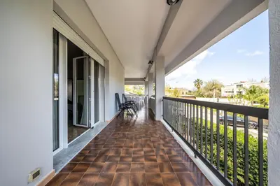 a balcony with a view of the street at La Maison De Provence - MONDELLO in Mondello