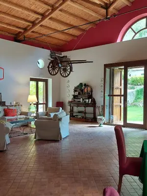 a living room with a couch and a table at Chiosi Country Club in Corleone