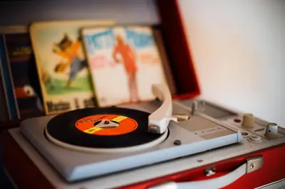 a cd sitting on top of a record player at B&B Novecento in Palermo