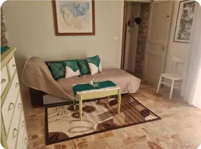 a living room with a couch and a table at Casa Mimì in Castellammare del Golfo