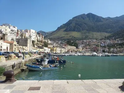 a group of boats in the water near a city at Casa Mimì in Castellammare del Golfo