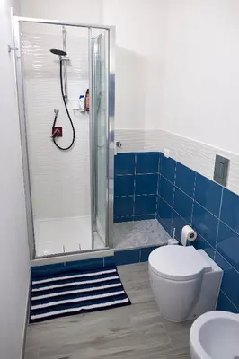 a bathroom with a shower and a toilet and a sink at Costa del Golfo in Castellammare del Golfo