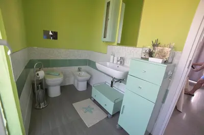 a bathroom with a sink and a toilet at STANZINA DELLA BARONESSA in Carini