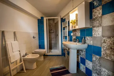 a bathroom with a sink and a toilet at Piccolo Sole d'oro - appartamenti in Calatafimi