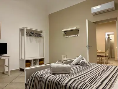 a bedroom with a bed with two towels on it at Palermo Centre - Apartments with Private Balcony or Terrace in Palermo