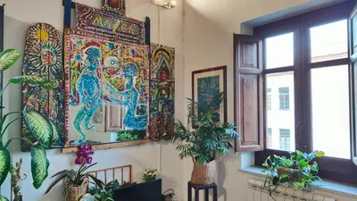 a living room with a stair case and a couch at Anna's Home in Historical Center in Palermo