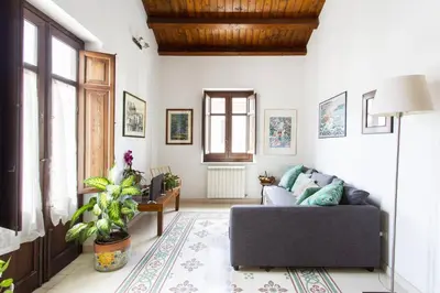 a white cabinet with plants on top of it at Anna's Home in Historical Center in Palermo