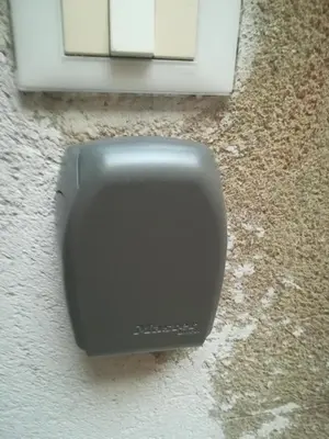 a black soap dispenser on the side of a window at Anna's Home in Historical Center in Palermo