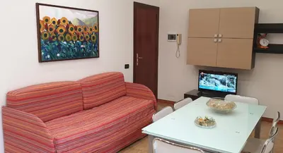 a living room with a couch and a table at Casa Vacanze L'isola del Relax in Isola delle Femmine