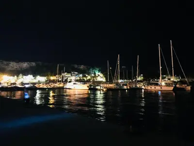 a group of boats docked in a harbor at night at B&b IL FIOCCO E LA RANDA in San Vito lo Capo