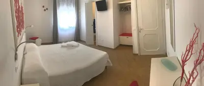 a hospital room with a white table and a window at B&b IL FIOCCO E LA RANDA in San Vito lo Capo