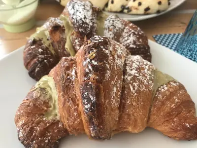 a white plate of pastries on a table at B&b IL FIOCCO E LA RANDA in San Vito lo Capo