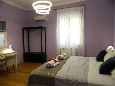 a bedroom with a bed with a stuffed animal on it at LE STANZE DI LUCA in Palermo