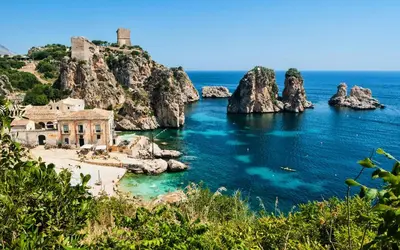 a view of a beach with rocks in the water at Casa Lidia in Castellammare del Golfo