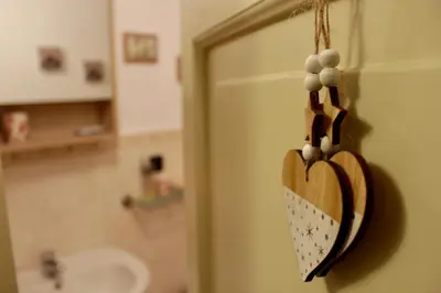 a heart hanging on the door of a bathroom at VUCCIRIA 57 locazione turistica nel cuore pulsante della movida! in Palermo