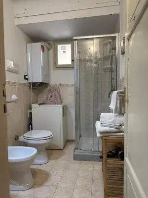 a bathroom with a toilet and a shower at VUCCIRIA 57 locazione turistica nel cuore pulsante della movida! in Palermo