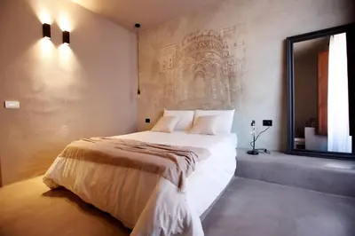 a bedroom with a large bed and a window at Casa Nostra Luxury Suites & Spa in Palermo