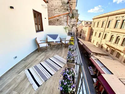 a balcony with a view of a building at Casa Nostra Luxury Suites & Spa in Palermo