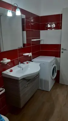 a bathroom with a washing machine and a sink at Da Ida e Gianni in Castellammare del Golfo