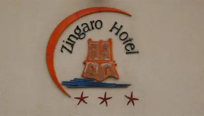 a sign on a wall with the name of a radio house at Zingaro Hotel in San Vito lo Capo
