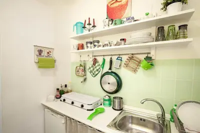 a kitchen with a sink and a counter top at Trip Rooms in Palermo
